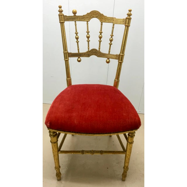 Great occasional side chair with gold paint, decorative spindles, and a soft red velour seat. Sure to make an impression...