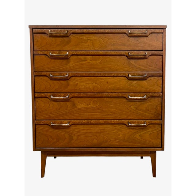Vintage mid-century modern four drawer dresser featuring clean architectural lines and a streamlined silhouette. The...