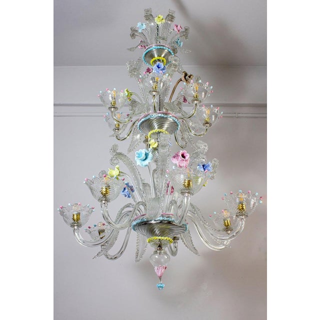 Spectacular murano chandelier. The arms 14 are arranged on two floors. The glasses are embellished with colorful...