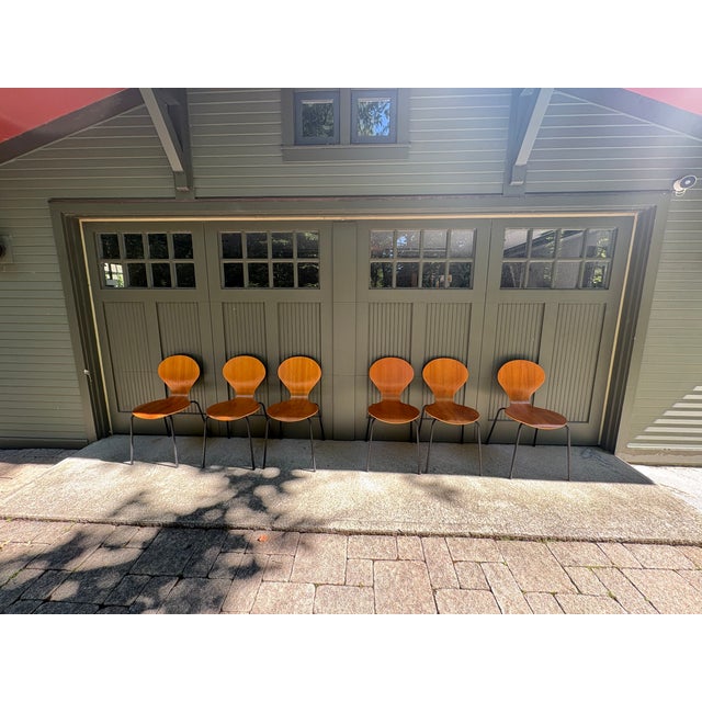 A striking set of six Phoenix dining chairs made in the style of Arne Jacobsen's "Ant Chair", manufactured in Denmark in...