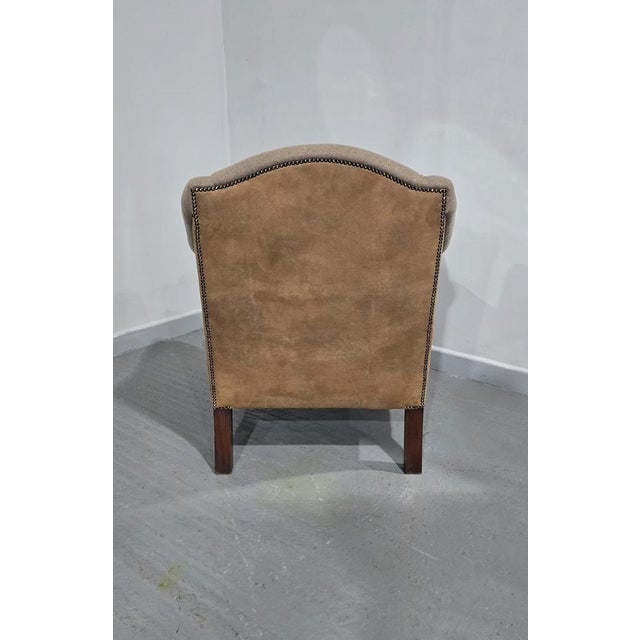 A very nice quality mahogany ball and claw foot armchair with herringbone style upholstery to the front and faux suede...