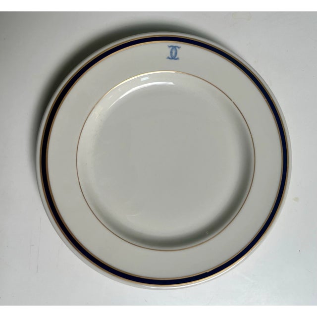Set of 16 10” dinner plates with the insignia of the Colony Club in New York City