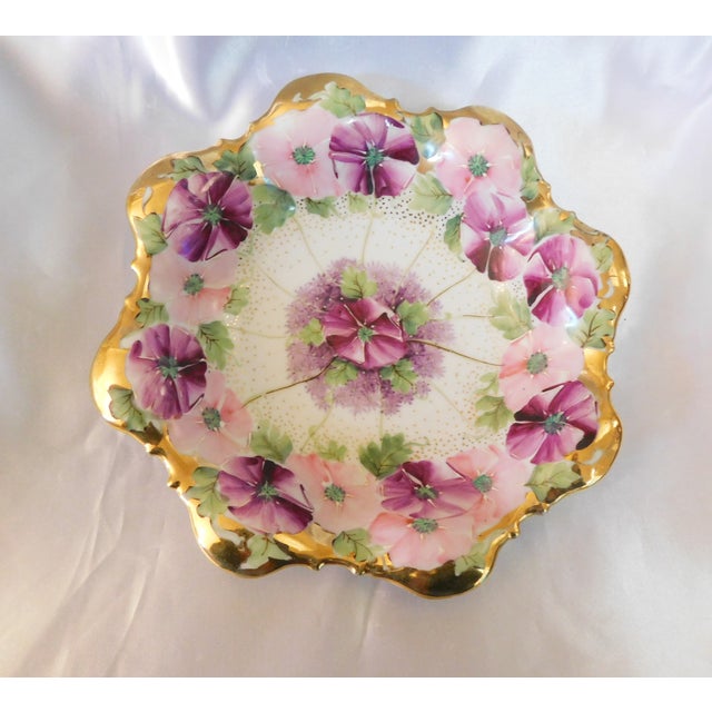 This is a small bowl of alternating dark and light pink flowers with hand painted white details plus gold glitter. The...