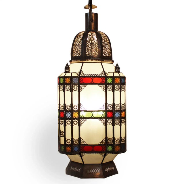 Large hand cut vintage traditional metal work Moroccan lantern with frosted white glass and colorful red blue amber and...