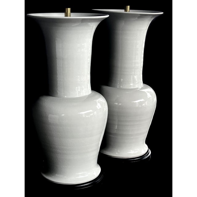 each of impressive scale (25.5" to top of ceramic, 12" diameter) featuring a curvaceous and sculptural baluster form with...