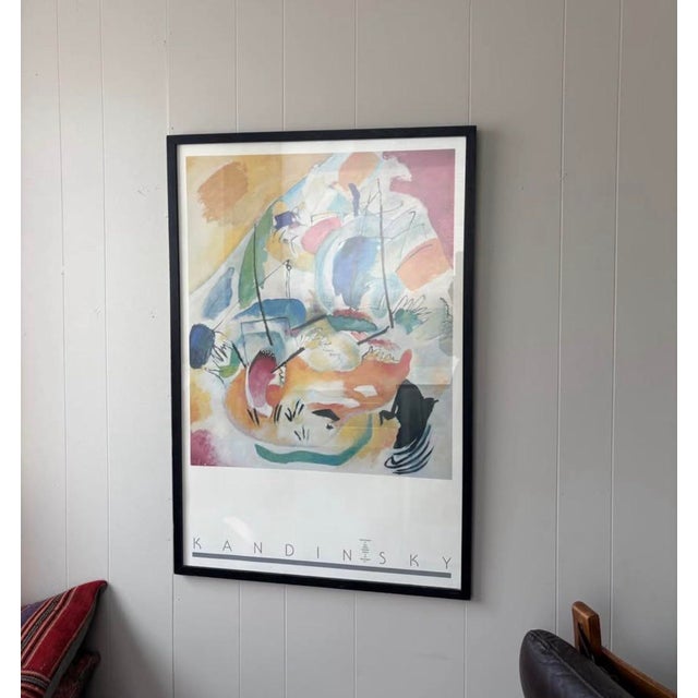 A large vintage exhibition poster featuring an abstract composition by pioneering artist Wassily Kandinsky, professionally...