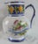Charming French faience hand-painted cognac branded bistro pitcher. This delightful pitcher has vibrant colors and is of...