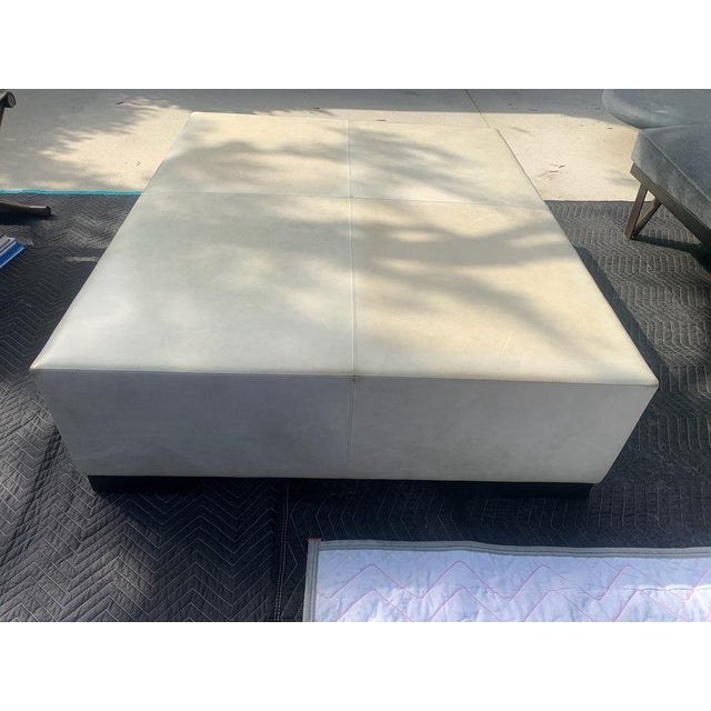 Galet Ottoman Attributed to Christian Liaigre. Feet are an epoxy-coated metal. Upholstery is Keleen Leather (Capri). Scuff...