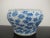 Antique, 19th century Chinese cache pot. White porcelain with blue scrolling peonies design. Good condition, showing some...
