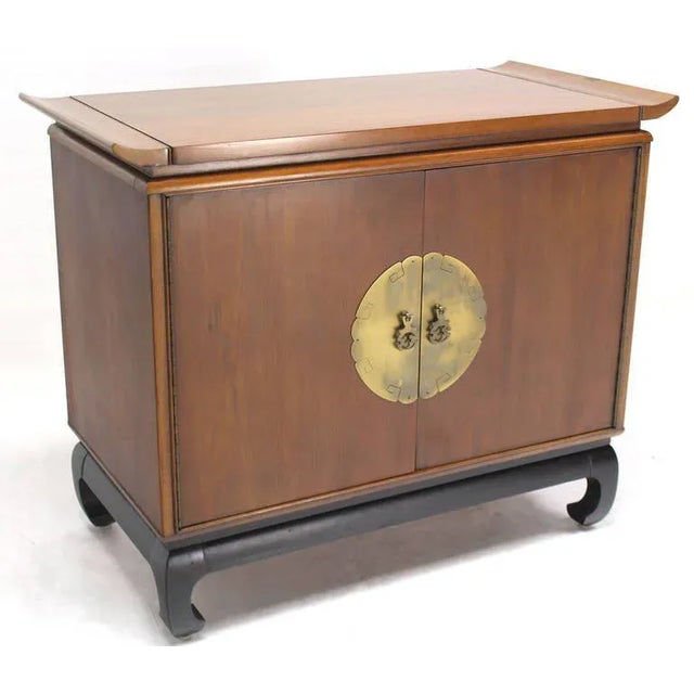 Very nice mid-century modern walnut cabinet with beautiful brass hardware on black ebonised base.