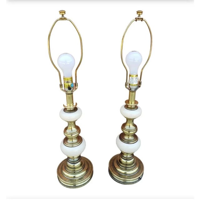 An exquisite pair of Victorian style solid brass and porcelain table lamps by Stiffel. Very good vintage condition. Comes...