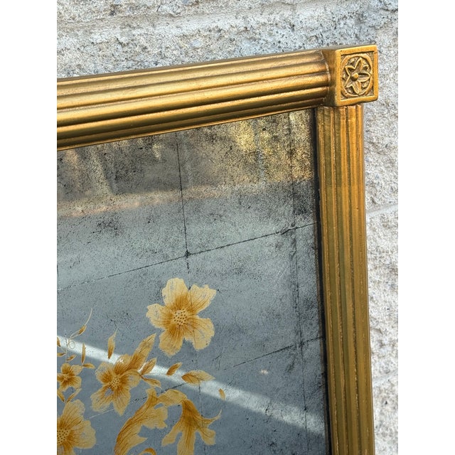 This large Whitehall wall mirror by John-Richard features a stunning églomisé surface accented with hand painted black and...