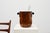 A refined and sculptural Art Deco ice bucket from France, dating to around 1925 and crafted in richly figured burlwood....