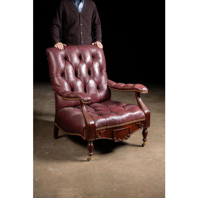 c. 1980s; (likely) Hancock and Moore, Inc. - Hickory, NC Vintage leather armchair and ottoman set with hidden drawer. This...