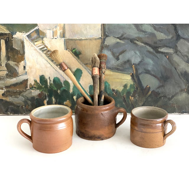 French stoneware pot in the traditional brown clay from the Normandy region. With a single applied handle, this was a...