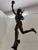 Tall patinated bronze figure of Mercury or Hermes after the famous model by Giambologna, shown in flight with a winged...