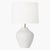Handcrafted in ceramic, the Cadley one-light table lamp by Hable features a uniquely shaped base in a black or white...