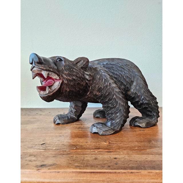 A large and most impressive original late 19th century Swiss Black Forest style hand carved and painted wooden bear...