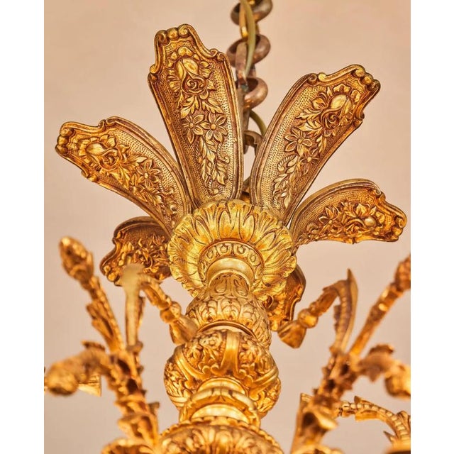 Classic castle chandelier cast from brass. The chandelier is richly decorated with plant decor and caryatids. The...