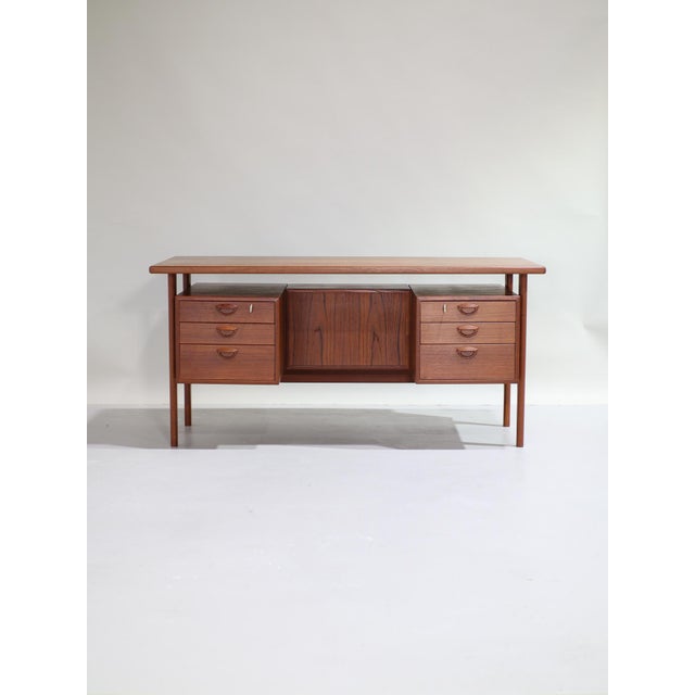 Beautiful double-sided FM60 desk with a floating top designed by Kai Kristiansen for Feldballes Møbelfabrik in Denmark,...