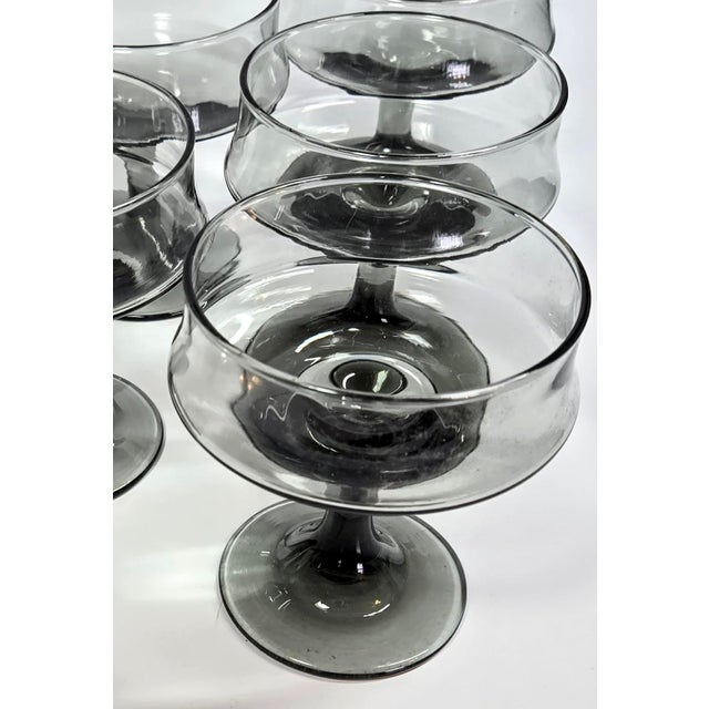 This is moonlight and magic, silk and shadows all tied up in smoke- specifically 60s to 70s smoke- the transition of...