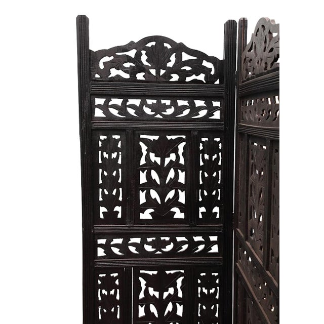 Beautiful vintage mango wood 4 panel leaf carved design folding screen. Hinged to be free-standing for use as a decorative...