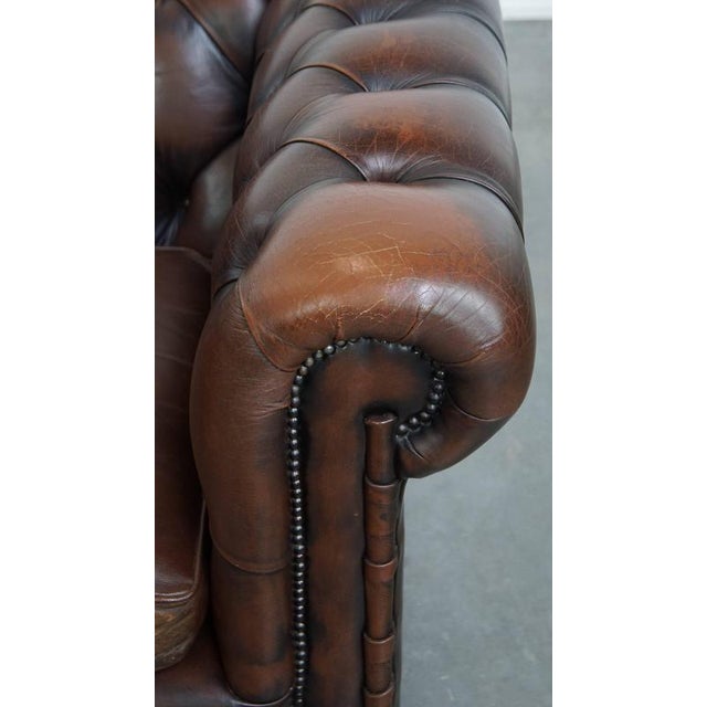 English Chesterfield Armchair in Dark Brown Cowhide with Decorative Studs For Sale - Image 12 of 16