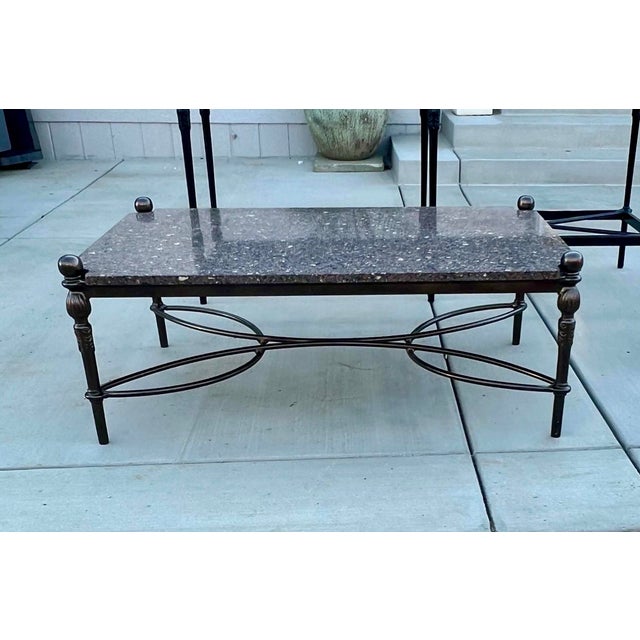 Gorgeous cast aluminum table that has been recently powder coated in a dark bronze. Top is newly cut Terrazzo marble.