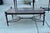 Gorgeous cast aluminum table that has been recently powder coated in a dark bronze. Top is newly cut Terrazzo marble.
