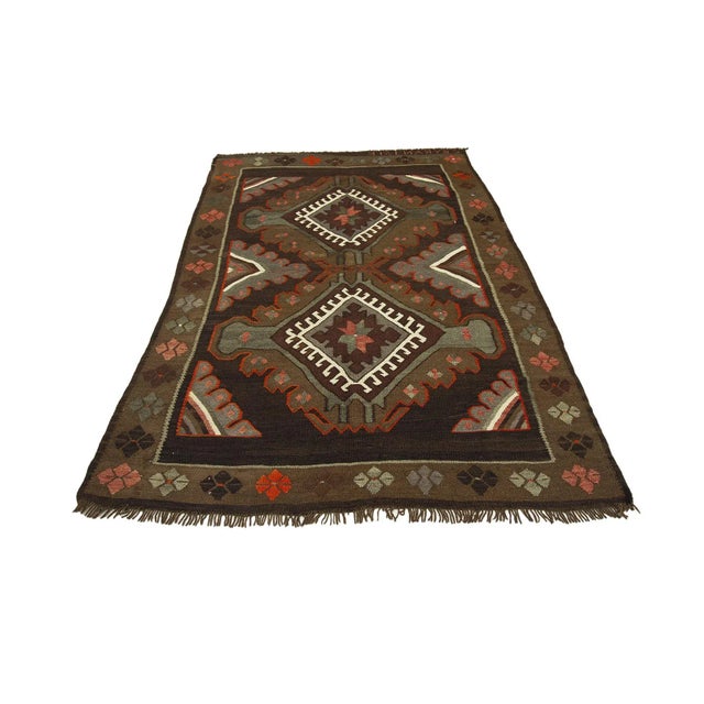 Vintage handwoven decorative kilim rug from Kars region of Turkey. Approximately 50-60 years old. In very good condition.