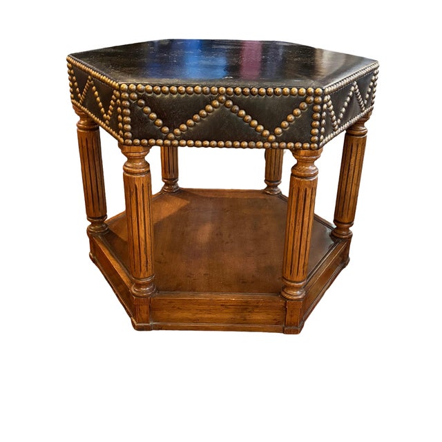 Pair of Heritage "Grand Tour" collection hexagonal side tables, featuring embossed dark leather-topped surfaces trimmed in...