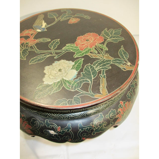 Chinese painted and ebonized stand. Five legs painted in a floral and bird scene, highlighted with gold tracings. Colorful...