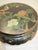 Chinese painted and ebonized stand. Five legs painted in a floral and bird scene, highlighted with gold tracings. Colorful...