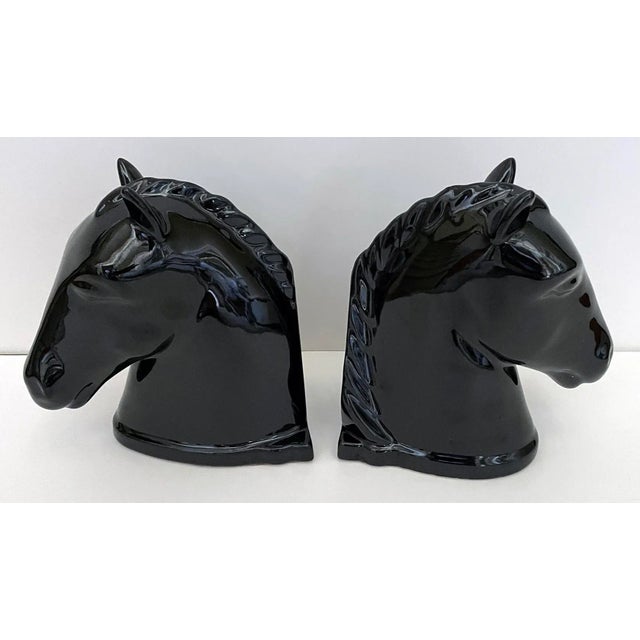 Pair of heavyweight vintage black horse head high gloss ceramic bookends. Original "Abingdon USA" stickers and felt...