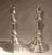 A tall and early pair of French solid brass candlesticks c. 1720. A fully developed form with base and knob ruffling and...