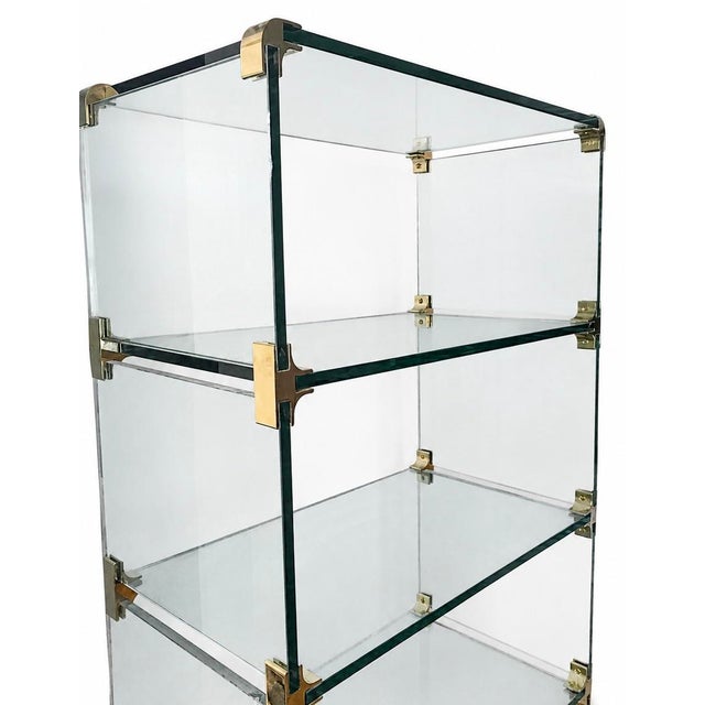 Striking vintage glass shelving unit designed by Leon Rosen for Pace Collection. This elegant piece features glass shelves...