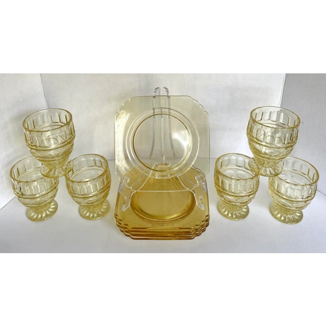 Here is a beautiful set of yellow depression era matching glasses and plates. As you can see, each piece has a wonderful...