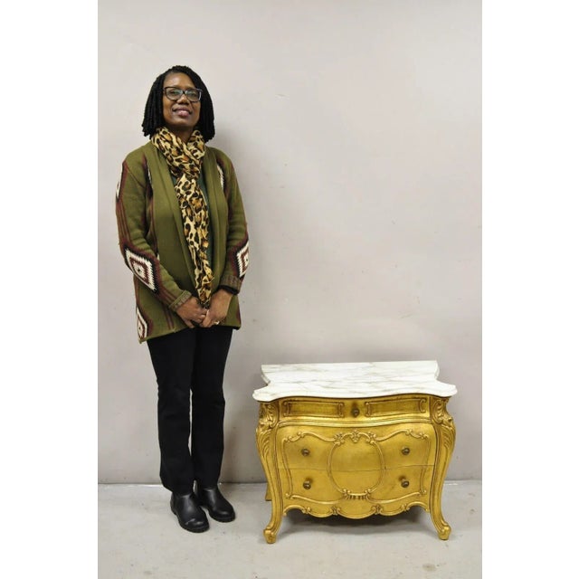 Vintage French Louis XV Style Gold Bombe Marble Top Nightstand by Daniel Jones. Item features a shapely marble top, three...