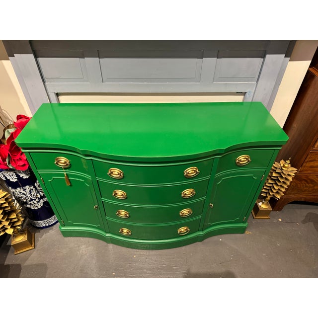 This is an vintage mahogany sideboard made by Drexel. It is painted with a European fine green lacquered paint. It has...