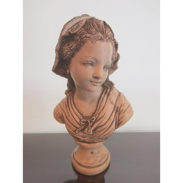 This beautiful sweet face girl is French style. I call her a girl in bonnet. The bust likely made of composed polychrome...