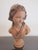 This beautiful sweet face girl is French style. I call her a girl in bonnet. The bust likely made of composed polychrome...