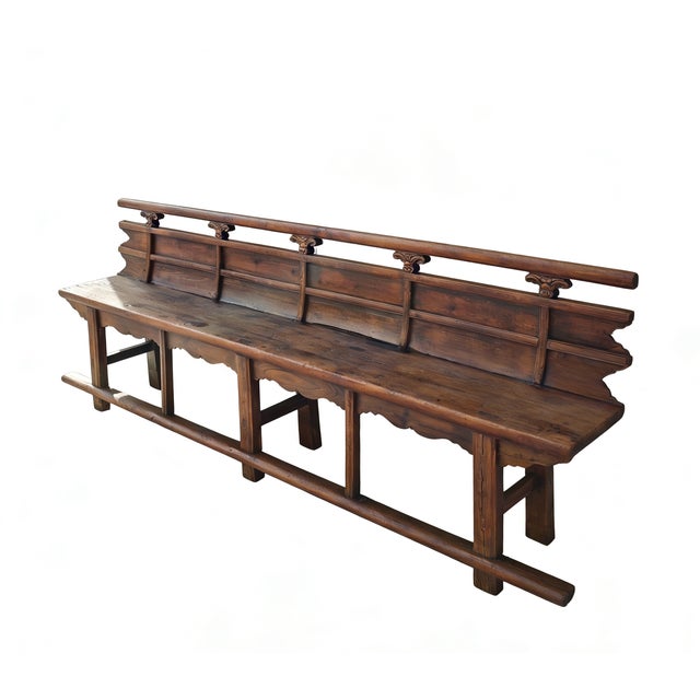 This antique Chinese bench showcases a blend of traditional craftsmanship with its decorative hand-carved spandrels. Made...