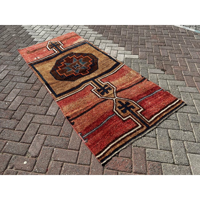 This gorgeous hand knotted Vintage Anatolian area rug is approximately 60 years old in excellent vintage condition. The...