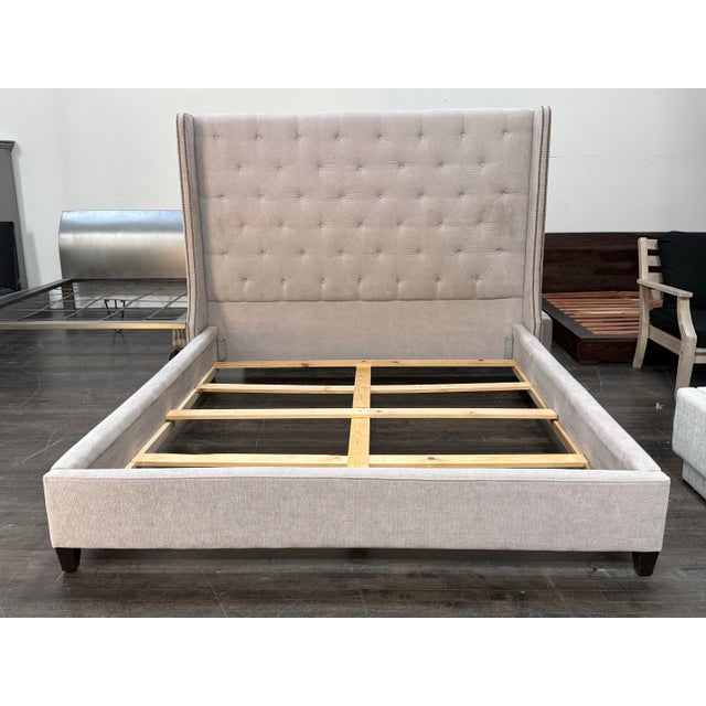 Design Plus Gallery presents a California King Size Upholstered Tufted Wingback Bed Frame from Restoration Hardware. The...