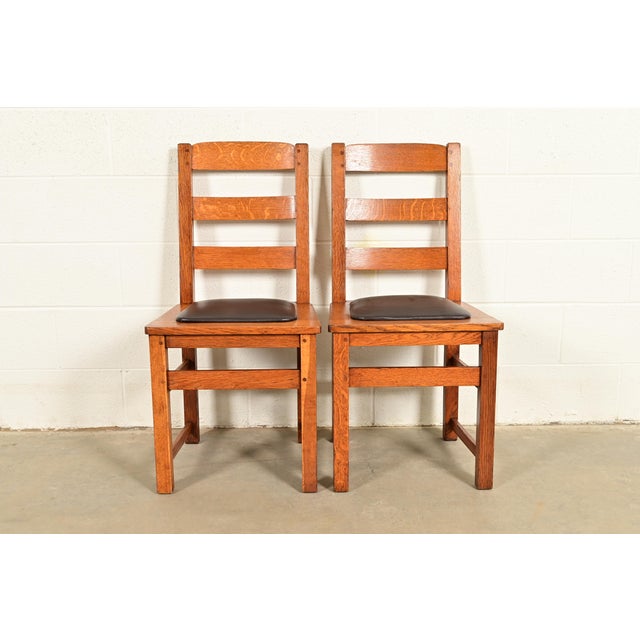A beautiful pair of antique Mission or Arts & Crafts ladder back dining chairs By Charles P. Limbert Co. USA, Circa 1910...
