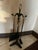 A sleek and sophisticated vintage fireplace companion set featuring an elegant combination of matte black iron and...