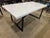 Striking in its simplicity, this Restoration Hardware Tarano dining table pairs the timeless beauty of a marble-inspired...