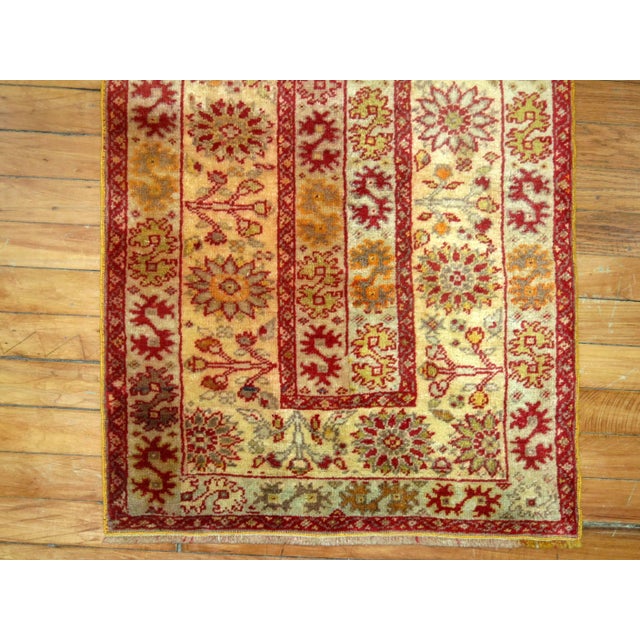 A fine narrow and small Turkish Sivas runner in rich red and gold tones. 2' x 6'5''