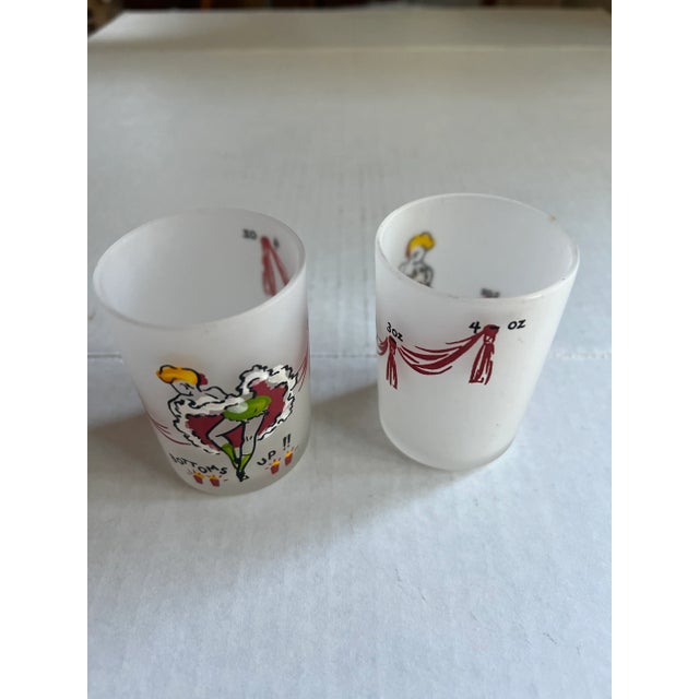Can Can Girls Bottoms Up Mid-Century Glasses. Glasses feature a can can girl with a red and white ruffled dress saying...