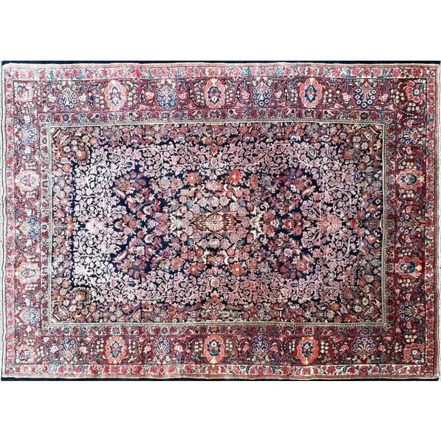 Step into a world of timeless elegance with our captivating Antique Persian Sarouk Carpet, a splendid wedding rug from...